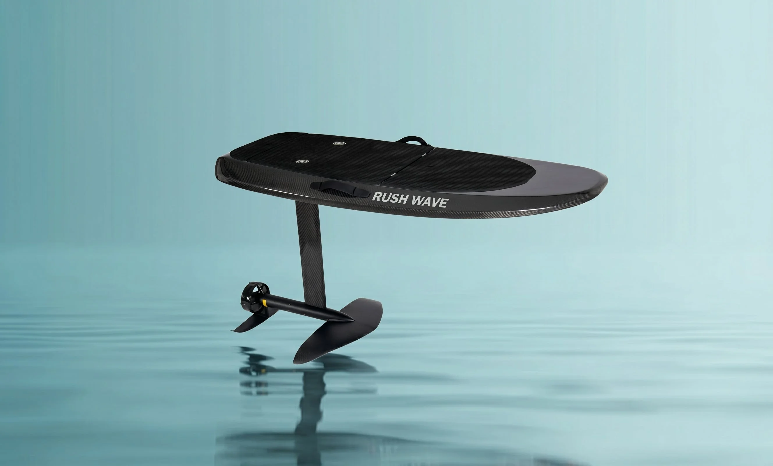 Y1 Carbon e-foil in flight over calm water